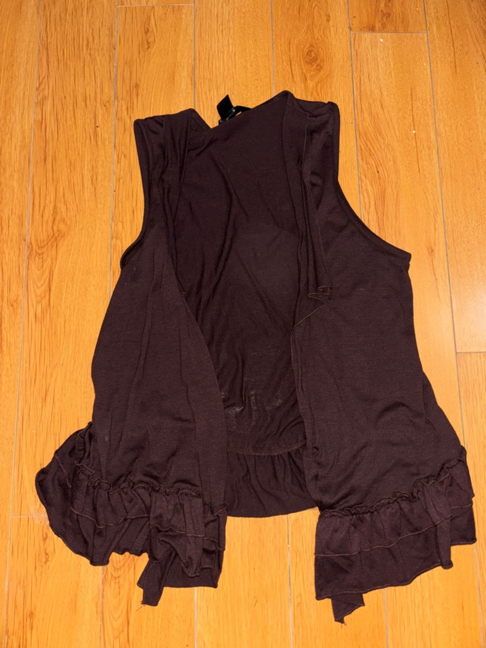 Sleeveless Ruffle-Hem Tunic Top in Black